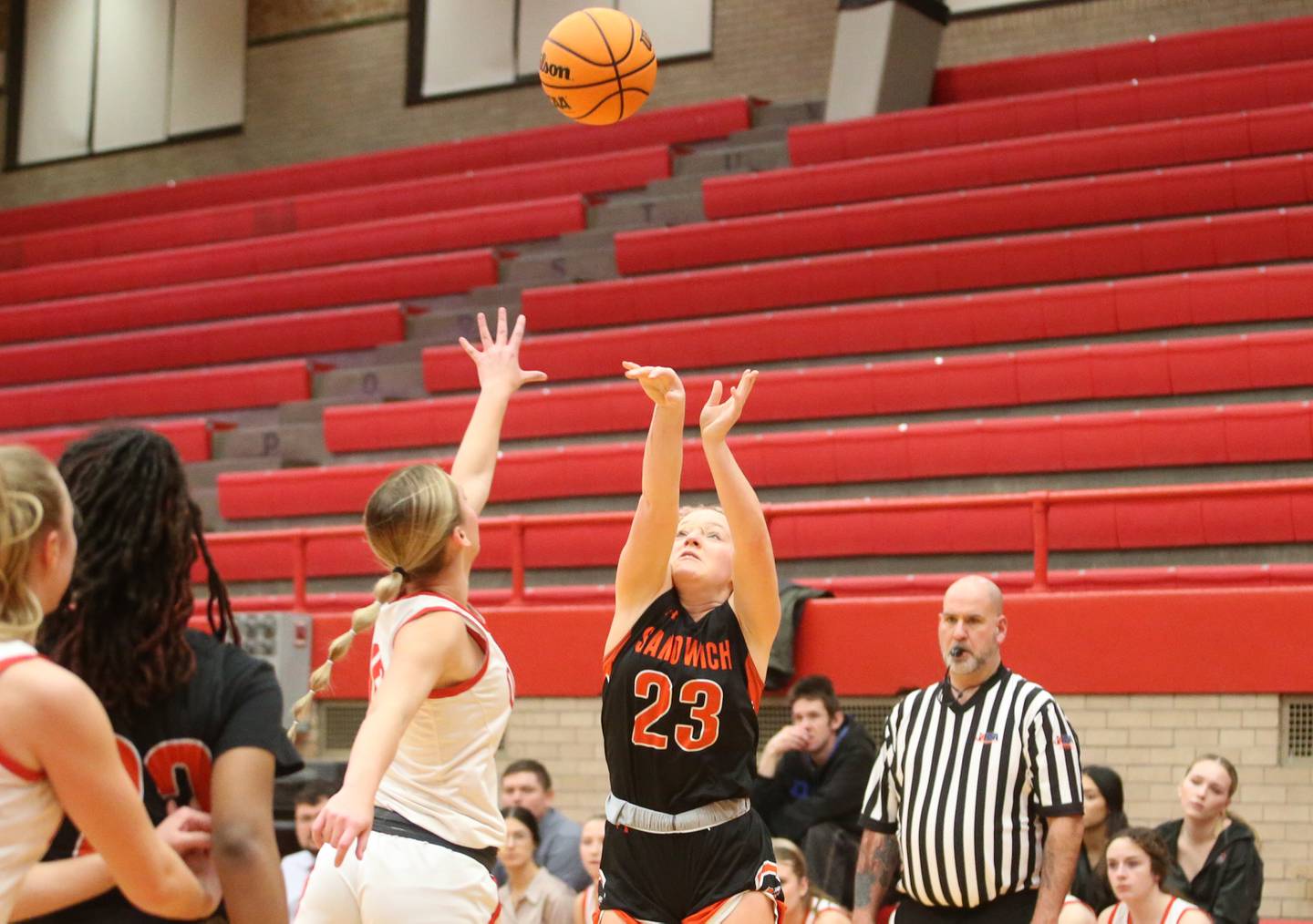 Sandwich's Bailey Frieders shoots a jump shot over Ottawa's Ella Schmitz on Monday, Jan. 27, 2025 in Kingman Gym at Ottawa High School.