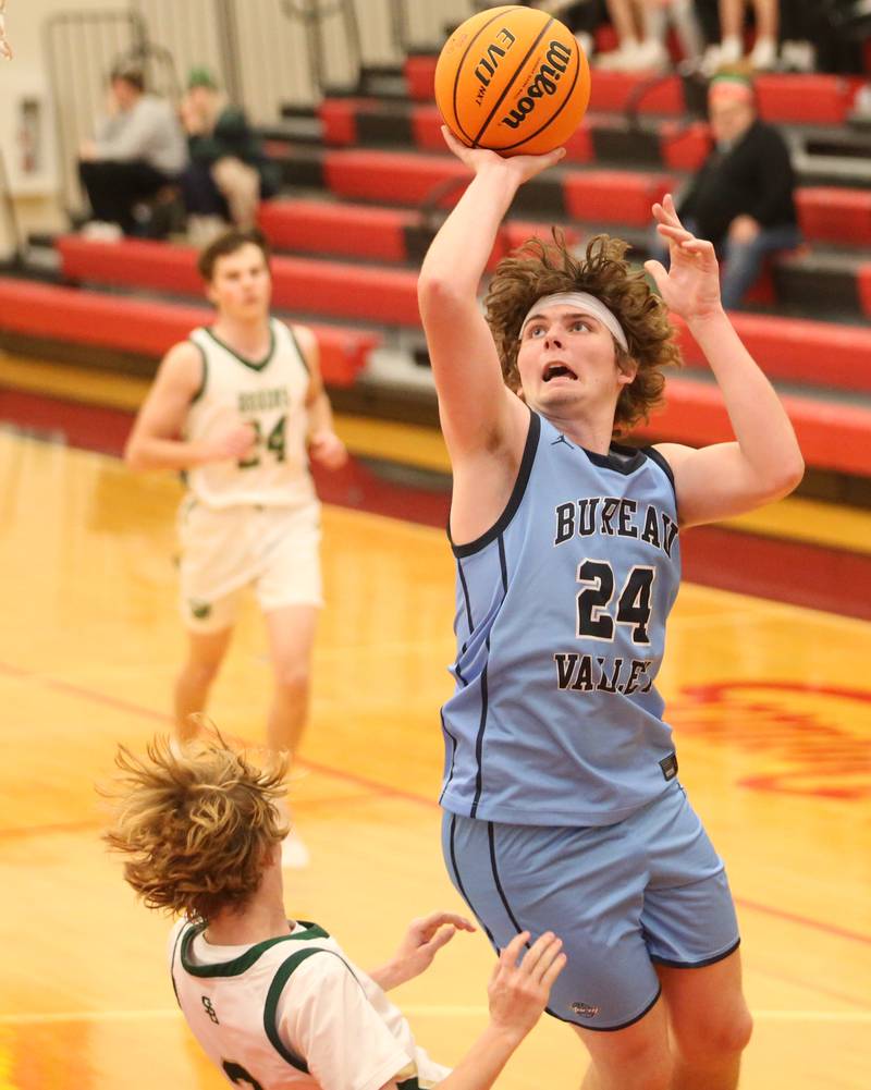 Bureau Valley's Landen Birdsley eyes the hoop as St. Bede's Kaden Nauman defends during the 50th annual Colmone Classic on Thursday, Dec. 12, 2024 at Hall High School.
