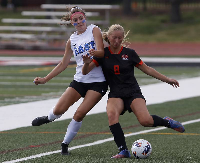 Lincoln-Way East's Ellie Feigl battles with Libertyville’s Jenna Krakowski for the ball in the IHSA Class 3A state third-place match at North Central College in Naperville on Saturday, June 3, 2023.
