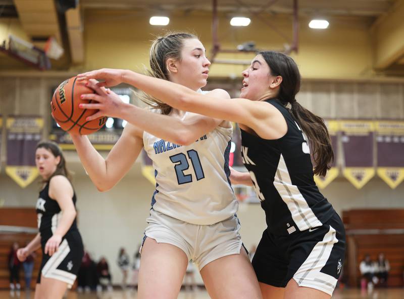 Nazareth's Olivia Austin (21) controls the ball during the girls 3A varsity super-sectional game between Nazareth Academy and Fenwick High School in River Forest on Monday, Feb. 27, 2023.