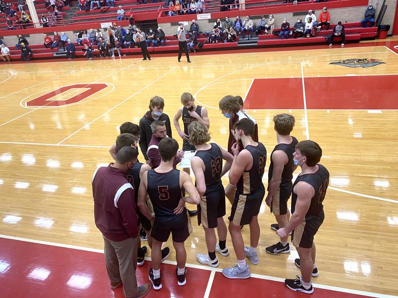 Morris boys basketball coach Joe Blumberg talks things over with his team just before the start of the second half Wednesday, Jan. 19, 2022, at Ottawa's Kingman Gym.