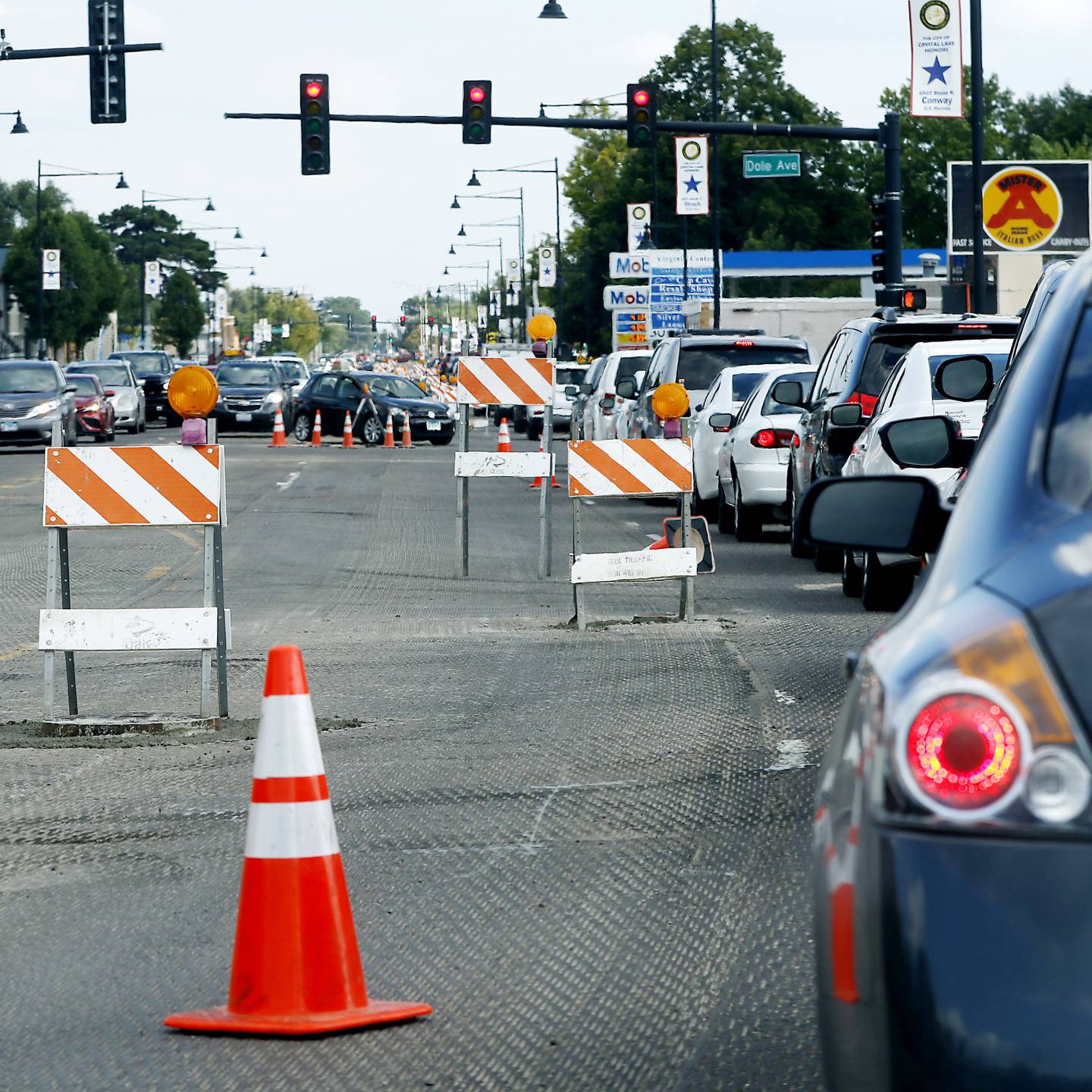 Traffic navigates roads construction on Illinois Route 14 near the intersection with Dole Avenue in Crystal Lake on Tuesday, Aug. 23, 2022. A lot of road construction programs in McHenry County cities are wrapping up, but some road projects, though will see work into the fall.