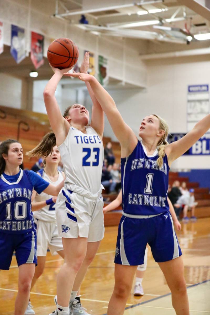 Princeton's Miyah Fox shoots over Newman's Jess Johns Monday night at Prouty Gym.