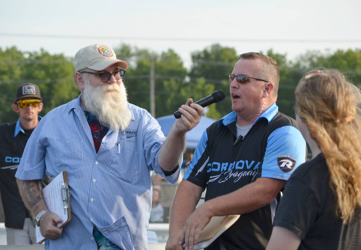 Announcer Tazz Hines and track owner Dan Crownhart are at the starting line before the races on Saturday, Aug. 27, 2022.