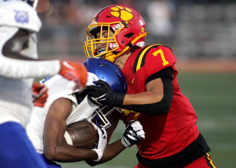 Batavia’s RJ Bohr (right) takes down a Phillips ball carrier during the season-opener in Batavia on Friday, Aug. 25, 2023.