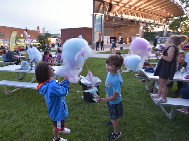 Kids enjoy cotton candy at the Cream of Wheaton summer festival in downtown Wheaton on Thursday, May 30, 2024.