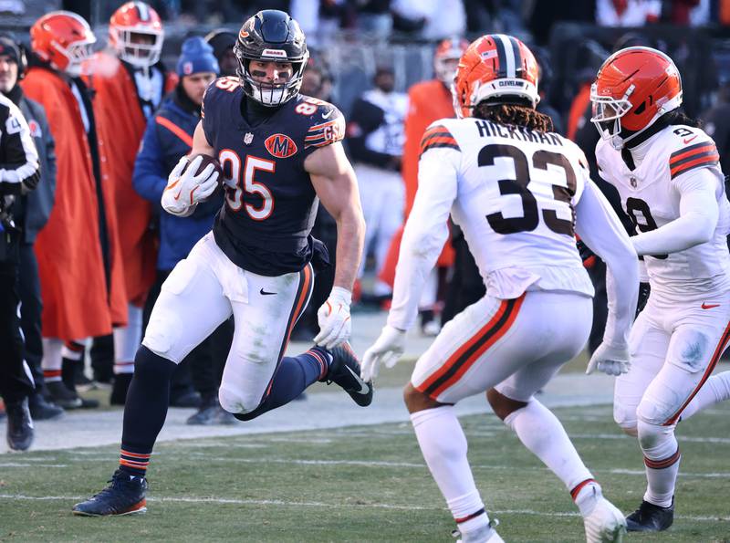 Chicago Bears tight end Cole Kmet looks to get by Cleveland Browns safety Ronnie Hickman during their game Sunday, Dec. 14, 2025, at Soldier Field in Chicago.