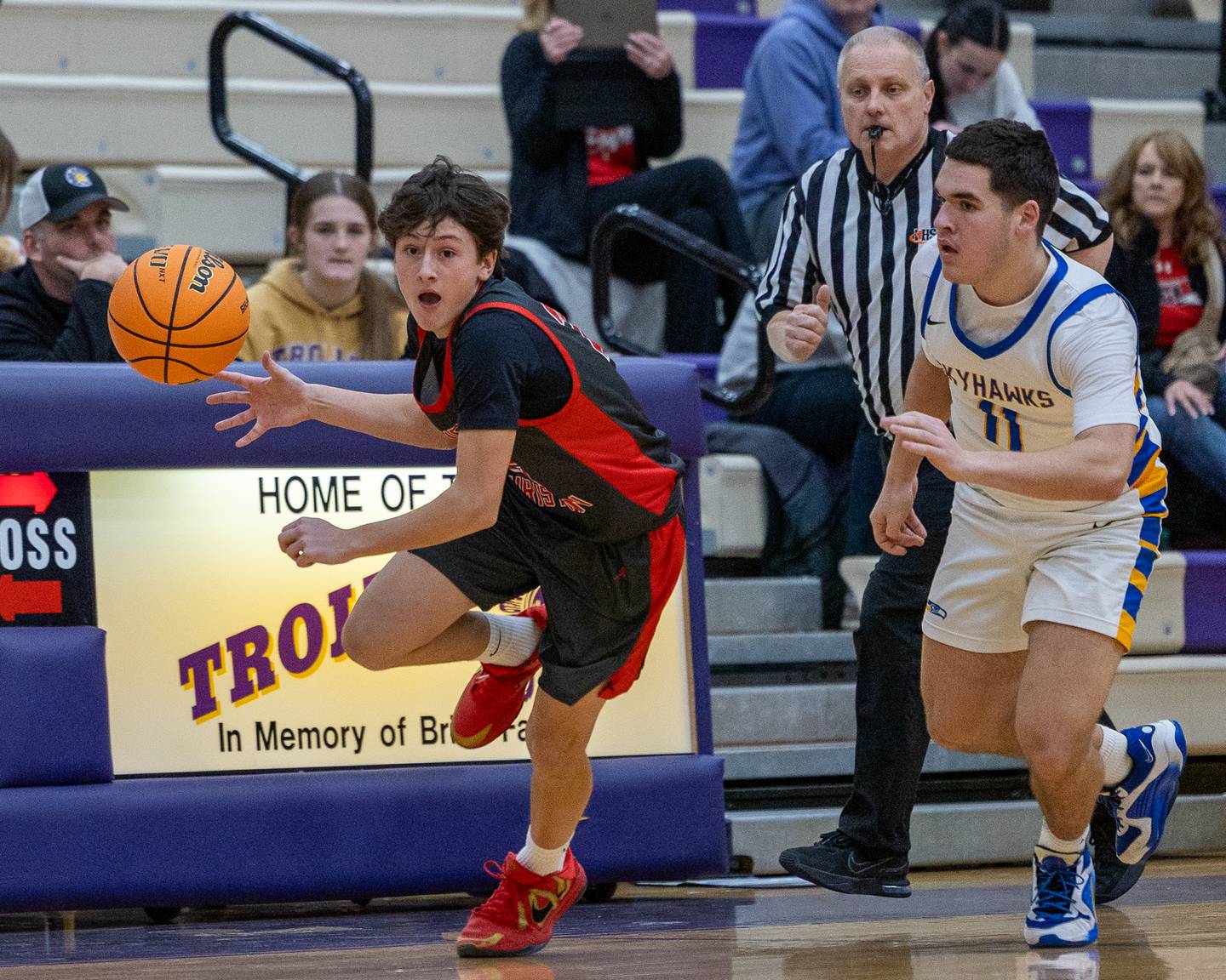 Ty Beebe (25) of Aurora Christain dribbles ball down sideline as Ryan Franze (11) of Johnsburg trails during the Class 2A Boys Sectional Basketball tournament game on Wednesday, March 4, 2026 at Mendota High School.