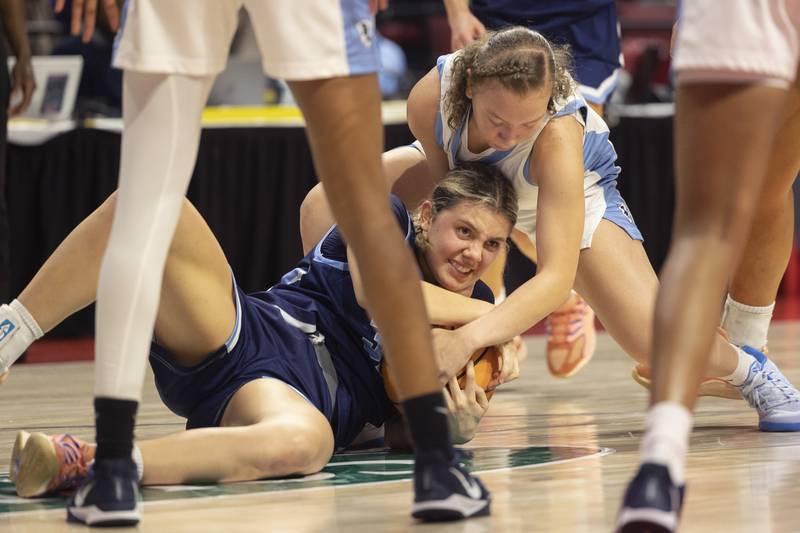 Nazareth’s Stella Sakalas grapples with Belleville East’s Vanessa Stacy Friday, March 6, 2026, in the Class 4A girls state semifinal game at CEFCU Arena at ISU.