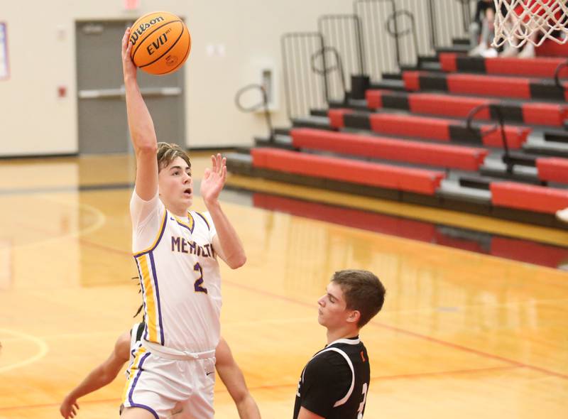 Mendota's Alex Beetz drives to the basket as Kewanee's Greyden Lewis defends during the 50th annual Colmone Classic on Thursday, Dec. 12, 2024 at Hall High School.
