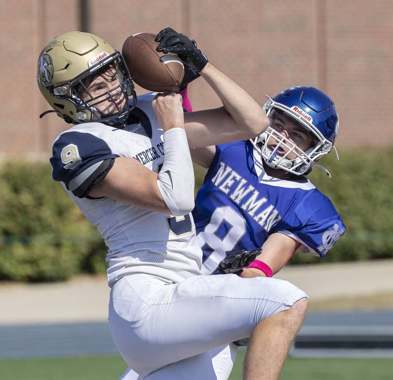 Mercer County’s Spencer Andresen hauls in a pass for a TD against Newman’s Jason Curtin Saturday, October 4, 2025.