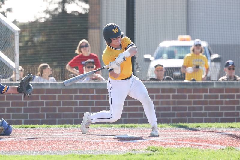 Joliet West’s Owen Young locks in on a pitch against Joliet Central on Monday, April 15, 2024.