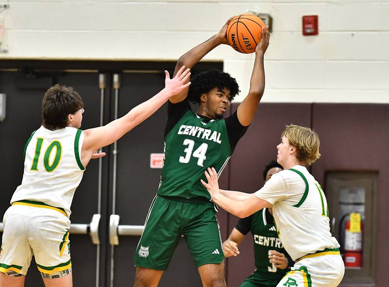 Plainfield Central's Ares Collins (34) getting double teamed during the WJOL tournament game against Providence Catholic on Friday, NOV. 28, 2025, at Joliet.