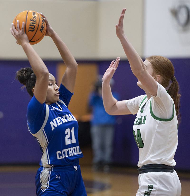 Newman’s Gisselle Martin looks to pass against Alleman’s Emilye Polich Friday, Dec. 26, 2025, at the Duchesses Basketball Christmas Classic.