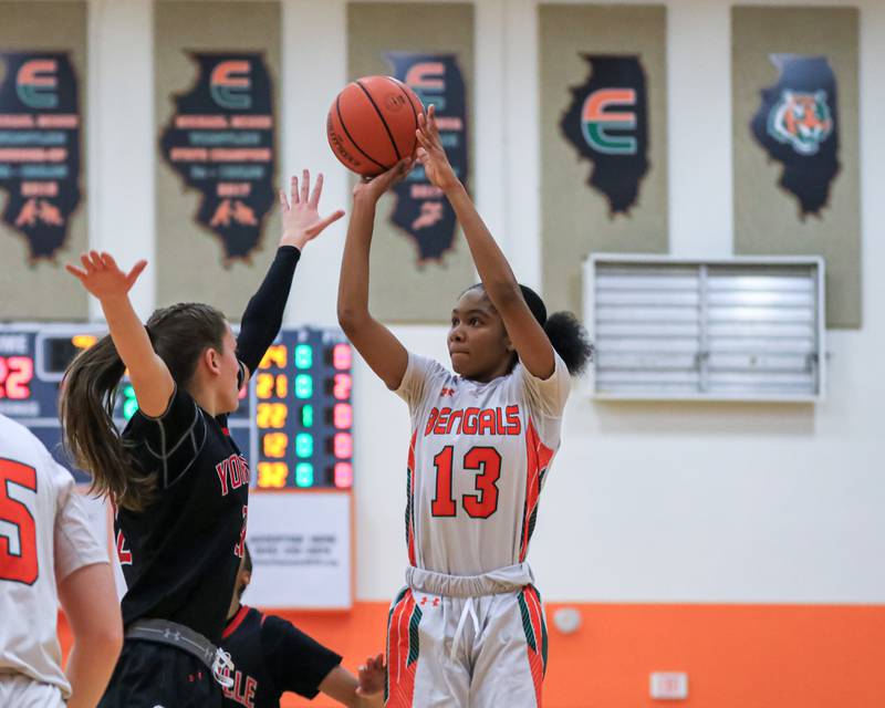 Plainfield East's Jocelyn Trotter (13) puts up a jump shot during varsity basketball game between Yorkville at Plainfield East.  Jan 3, 2023.