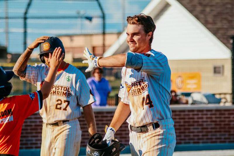Finley Buckner celebrates after hitting a two-run home run during the Illinois Valley Pistol Shrimp's 5-2 win over the Clinton LumberKings on Saturday, July 6, 2024 at Schweickert Stadium in Peru.