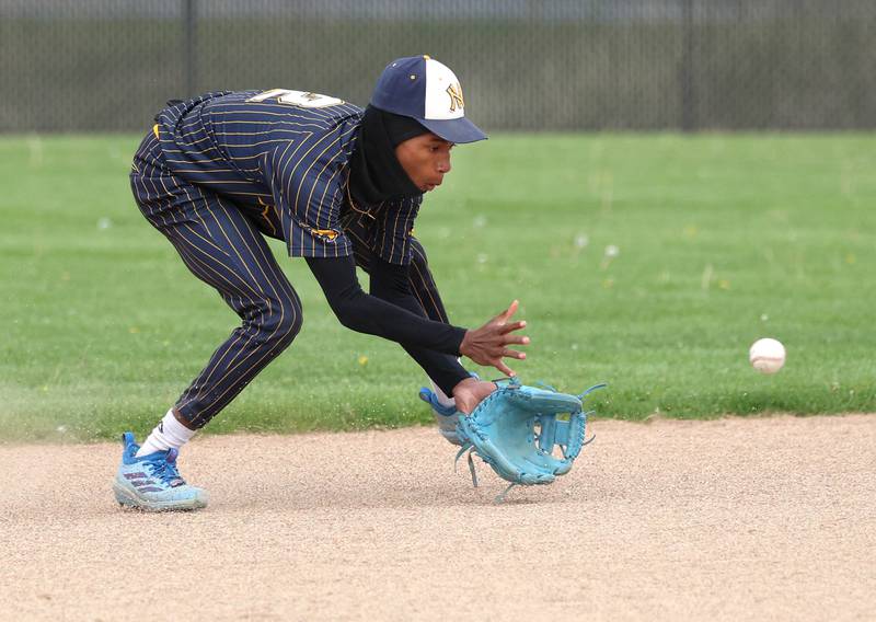 Neuqua Valley's Jaleel Glover fields a grounder Tuesday, May 5, 2026, during their game at DeKalb High School.