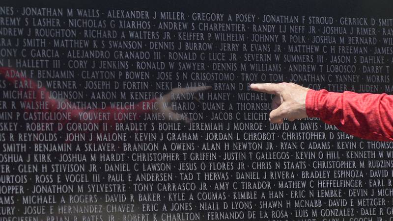 Many who came to the Middle East Conflicts Wall on Saturday, June 18, 2022, searched for the names of loved ones killed in action.