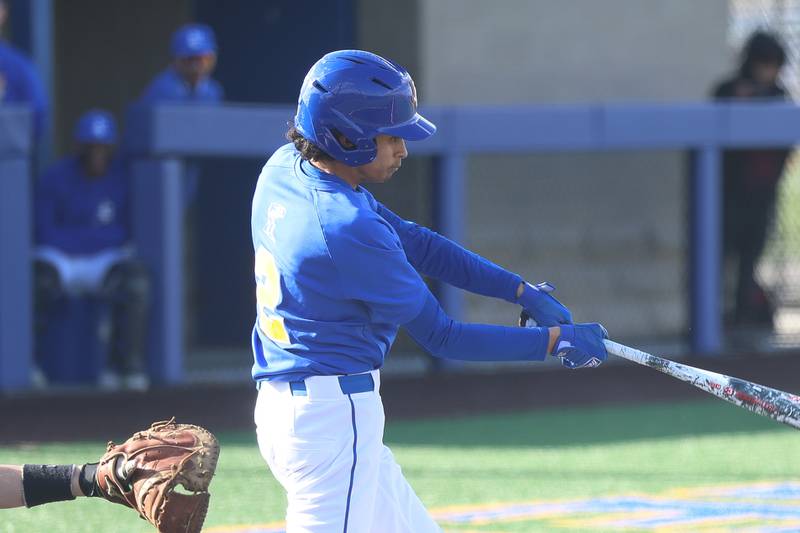 Joliet Central’s Xavier Lenoir connects against Minooka  on Monday, April 6, 2026 in Joliet.