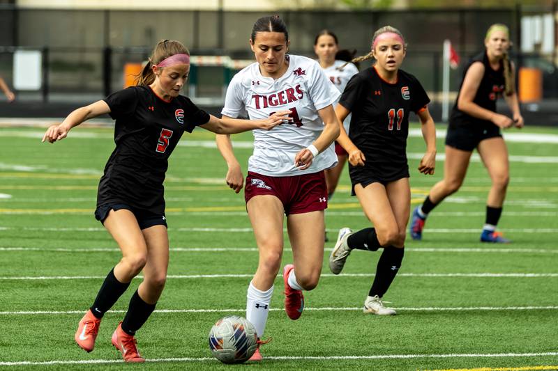 Plainfield North's Ilyana Barriball makes a move against Makayla Stengele of Plainfield East during the Varsity game on May 1, 2025.