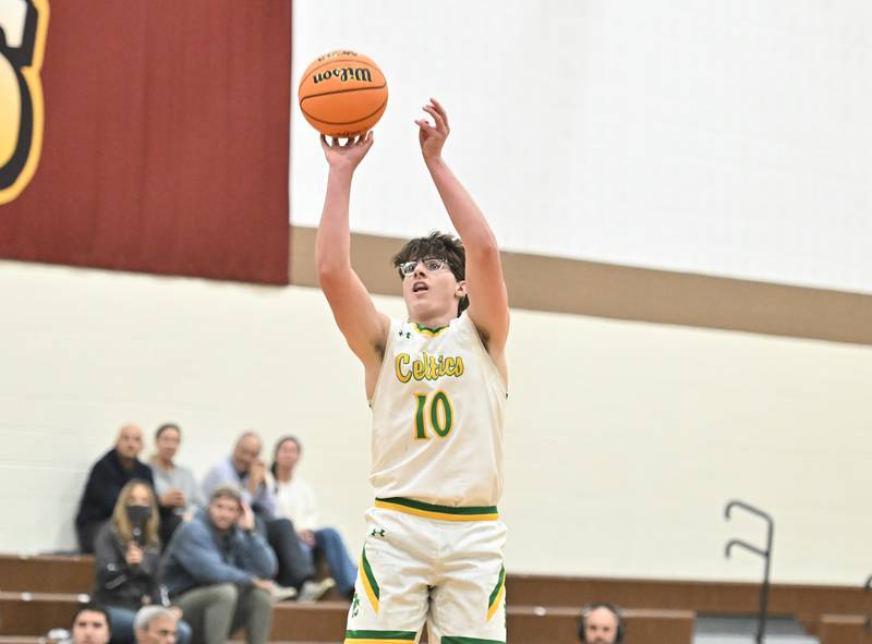 Providence Catholic's Cade Styrsky (10) shoots a deep 3 point shot during the WJOL tournament game against Plainfield Central on Friday, NOV. 28, 2025, at Joliet.