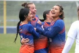 Photos: Genoa-Kingston Girls soccer wins regional title in driving rainstorm