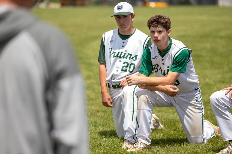 (20) Ryan Soliman of St. Bede kneels with teammate (3) Carson Riva in post game meeting on Saturday, May 24, 2025 at Stark County High School in Toulon.