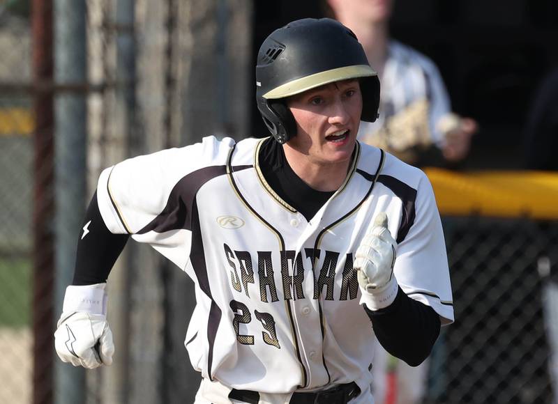 Sycamore's Henry Hamingson runs to first picking up an infield single during their game against St. Charles North Thursday, April 10, 2025, at the Sycamore Sports Complex.