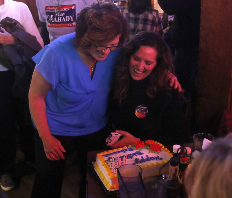 Mary Mahady, a candidate for McHenry County clerk, hugs her daughter, Rebecca Conton, as Conton celebrates her birthday during a Democratic election watch party Tuesday, Nov. 8, 2022, at The Cottage, 6 E. Crystal Lake Ave. in Crystal Lake.
