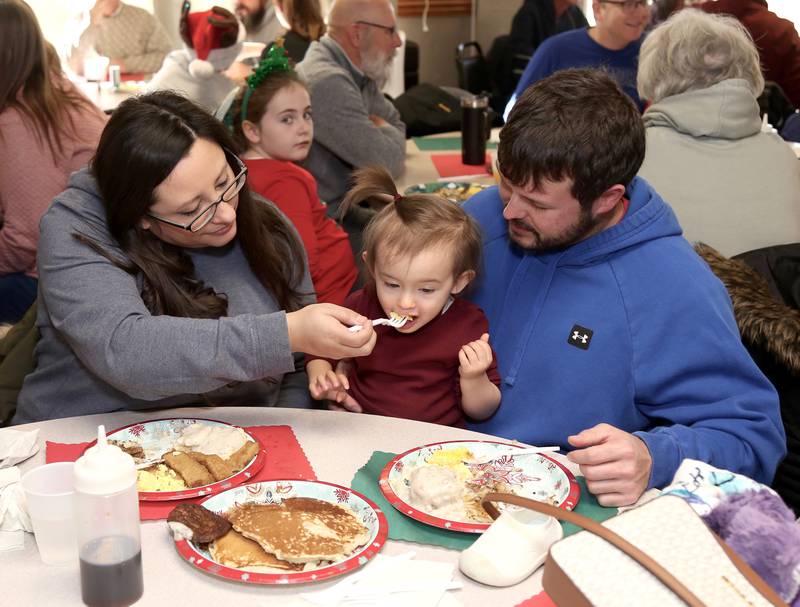 Danielle, Caly and Tommy McCartney have breakfast at Breakfast with Santa in Elburn on Sunday, Dec. 4, 2022.
