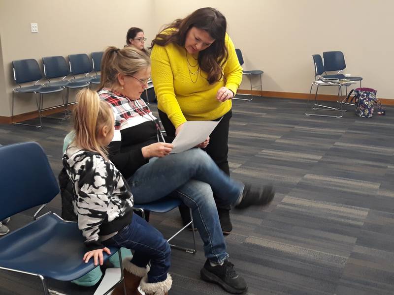 Streator Mayor Tara Bedei shows resident Nina Vaughn on Wednesday, Feb. 8, 2023, a map of possible locations in Streator where gardens can be grown to entice monarch butterflies.