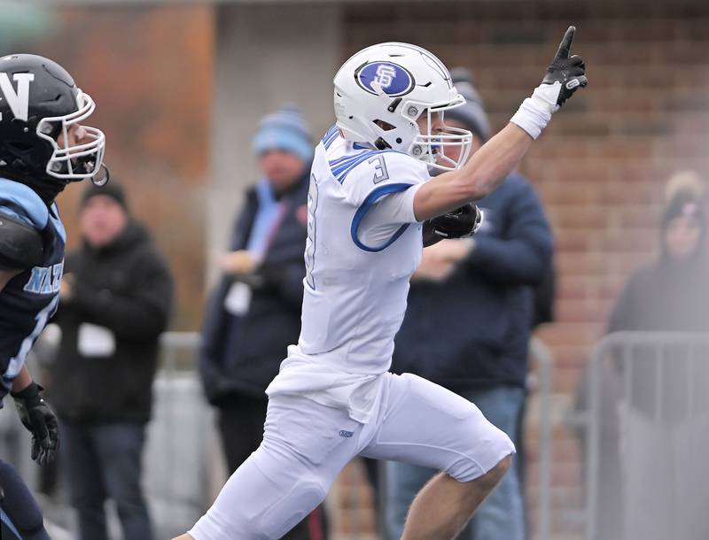 St. Francis’ Seth Valeri scores the Spartan’s first touchdown against Nazareth in the IHSA Class 5A state semifinal football game in La Grange on Saturday, Nov. 23, 2024.
