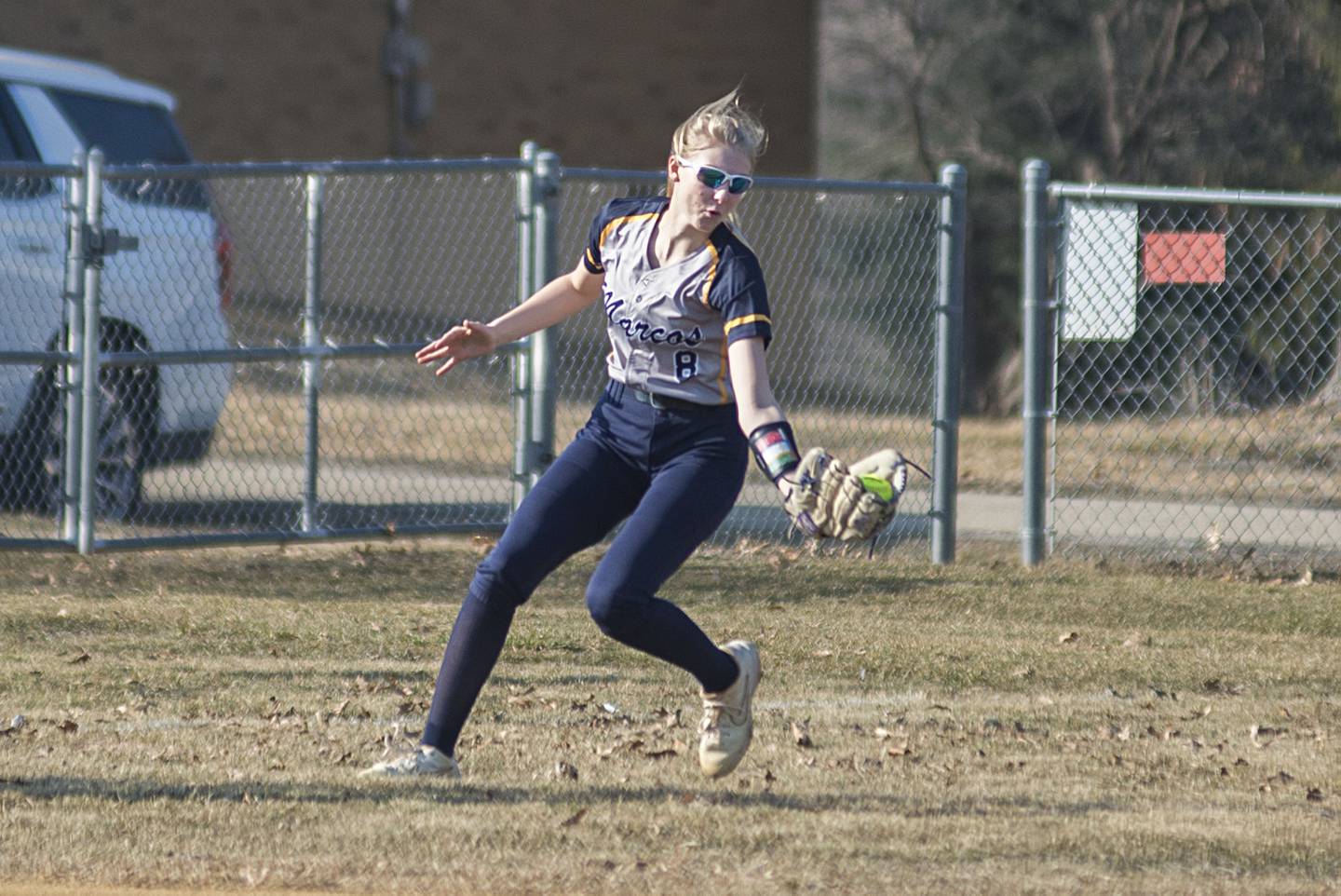 Polo's left fielder Sydnei Rahn catches a fly ball in the first inning on Tuesday, March 15, 2022 against Newman.