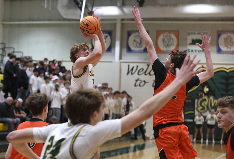 Crystal Lake South's Carson Trivellini shoots the ball over Crystal Lake Central's Danny Spychala during an IHSA Class 3A Crystal Lake South Regional boys basketball semifinal game on Wednesday, February, 25, 2026, at Crystal Lake South High School.