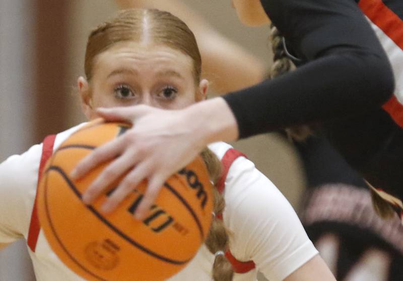 Huntley's Avery Seuss keeps her eyes on the ball as Libertyville's Lily Fisher brings the ball up the court during the IHSA Class 4A Huntley Sectional Championship girls basketball game on Thursday, Feb. 27, 2025, at Huntley High School.