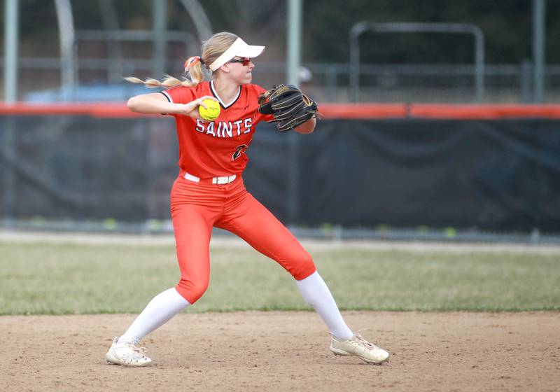 St. Charles East's Alyse Price makes a throw to first for an out during a game against Downers Grove North on Friday, March 28, 2025 in St. Charles.