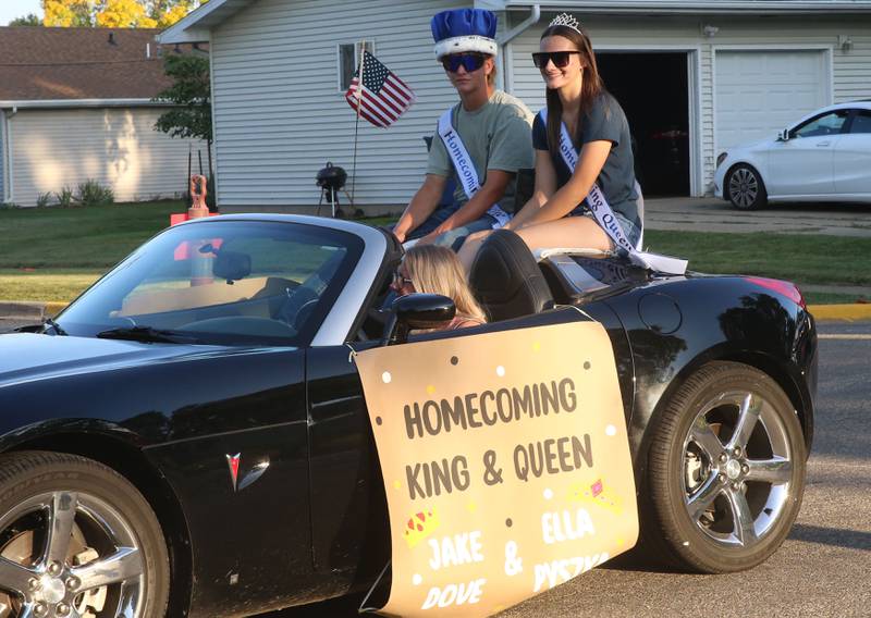 Putnam County High School homecoming king Jake Dove and Queen Ella Pyszka ride during the inaugural Homecoming parade on Wednesday, Sept. 17, 2025 down Elm Street in Granville.