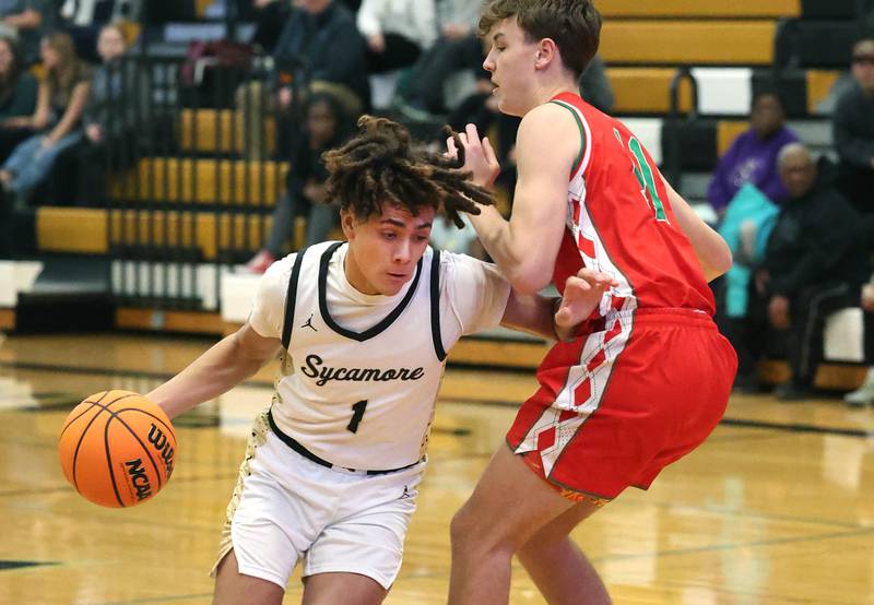 Sycamore's Josiah Mitchell tries to get around La Salle-Peru's Jameson Hill during their game Tuesday, Feb. 4, 2025, at Sycamore High School.