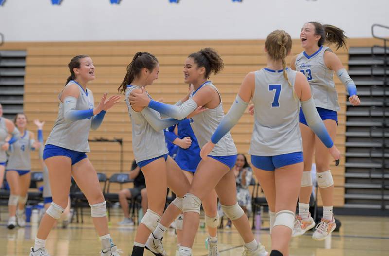 St. Charles North celebrate a point against Benet during a game on Wednesday, September 20, 2023.