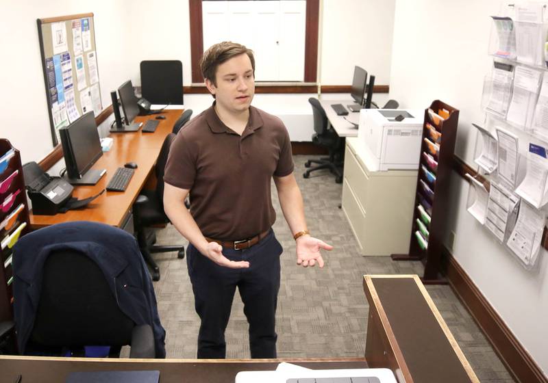 Nick DeMarco, 23, who works in the Dekalb County Courthouse Self Help Legal Center, talks Tuesday, April 16, 2024, about the benefits that the center provides those who use it. The center, which is on the first floor of the courthouse, provides procedural and legal information, forms, e-filing assistance and other resources to the public.