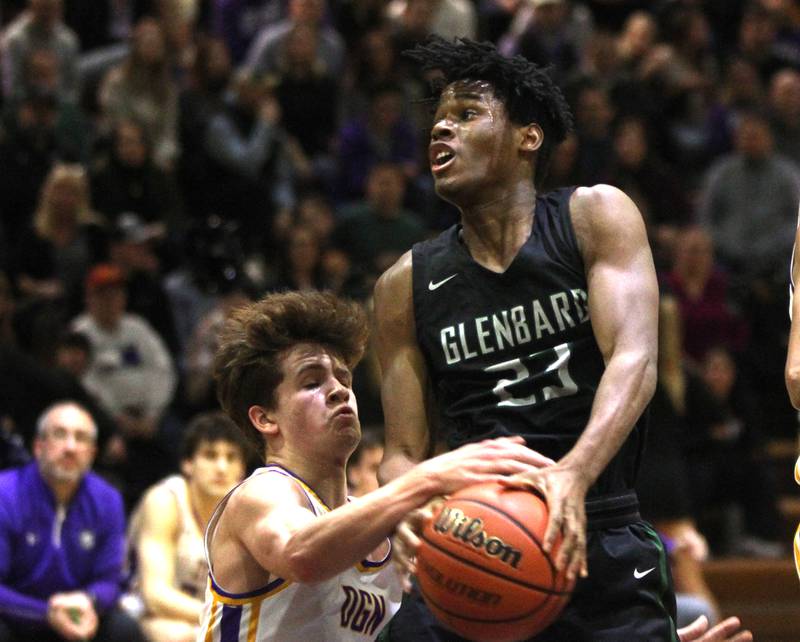 Glenbard West’s Benji Zander goes up for a shot during a game at Downers Grove North on Friday, Jan. 13, 2023.