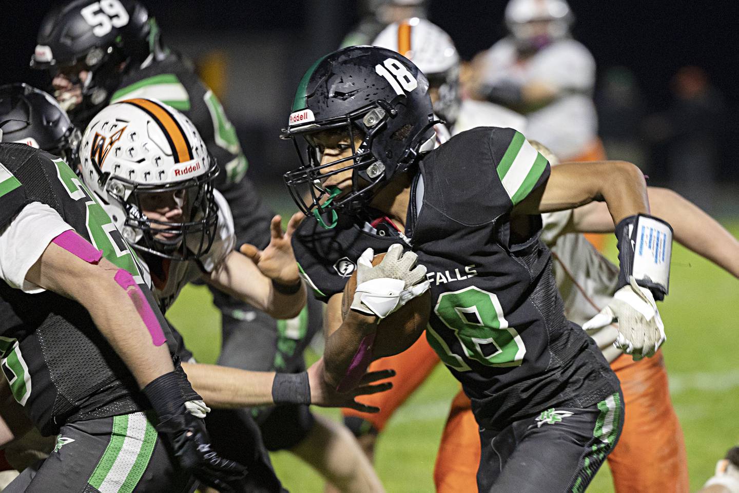 Rock Falls’ Michael Flowers looks for running room against Winnebago Friday, Oct. 20, 2023 in Rock Falls.