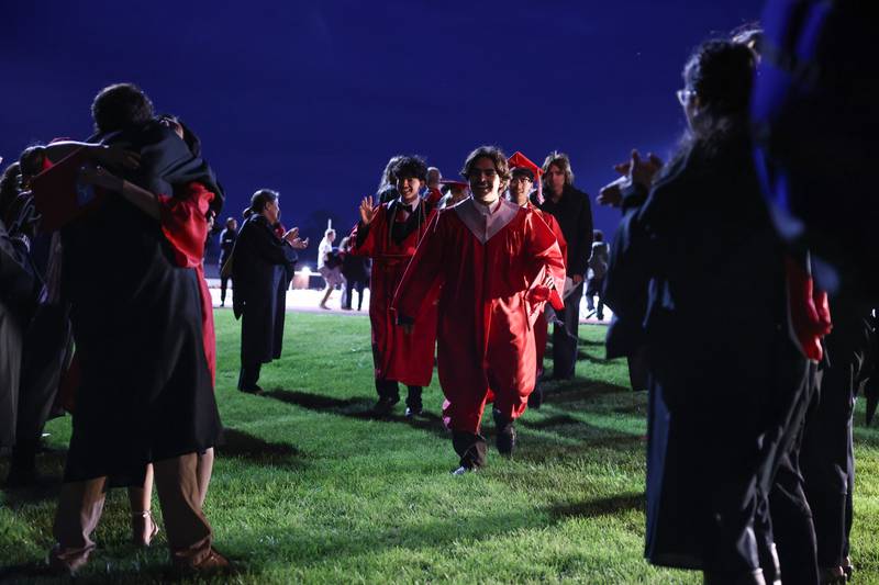 Graduates leave the stadium through an applauding tunnel of teachers and staff during the Bradley-Bourbonnais Community High School commencement ceremony on Thursday, May 21, 2026.