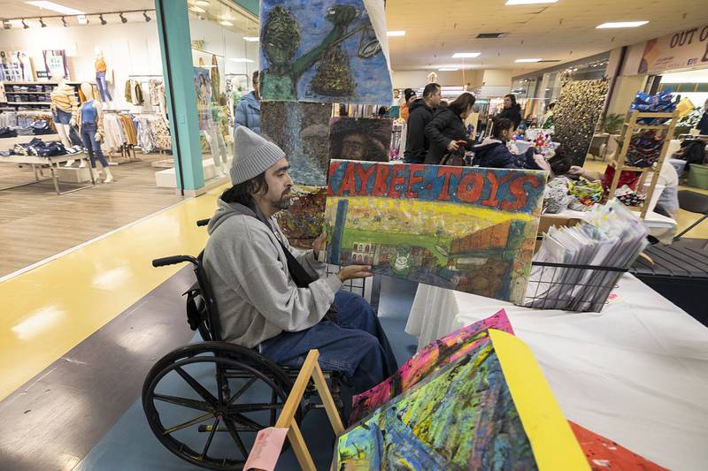Ben Perez of Sterling puts on display his original artwork Saturday, March 4, 2023 at the Northland Mall’s arts and crafts fair.