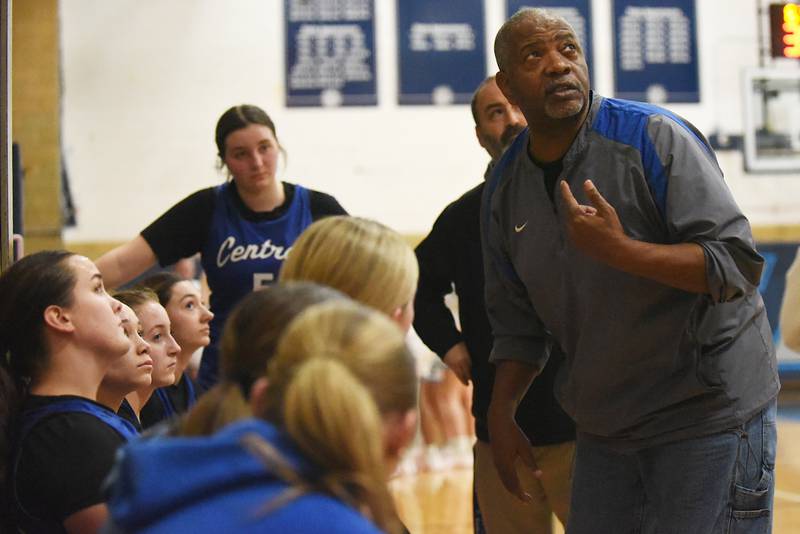 Clifton Central girls basketball coach Henry Hines, right, looks at the scoreboard during a timeout in a game at Cissna Park Wednesday, Feb. 4, 2026.