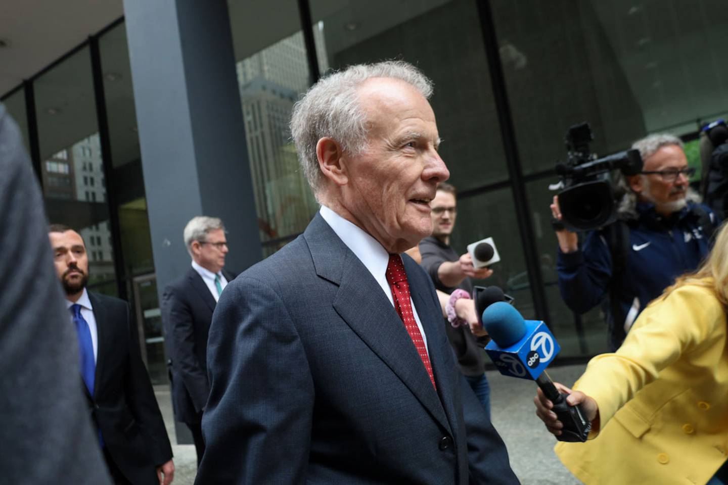 Surrounded by media, former Democratic House Speaker Michael Madigan, the longest-serving legislative leader in U.S. history, departs the Dirksen Federal Courthouse on June 13, 2025, after receiving a 7 ½-year prison sentence on corruption charges. He was also fined $2.5 million.