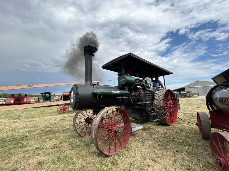 Charles Hubbard of Chana uses his 1916 Case steam engine to power a sawmill at the Bos Bros. Historical Farm Old Fashioned Fall Harvest south of Erie on Saturday, Sept. 21, 2024. Hands-on demonstrations of past agricultural chores were highlighted at the event. The sawmill was being used to cut cedar logs into a square so shingles could be made at another vintage machine.