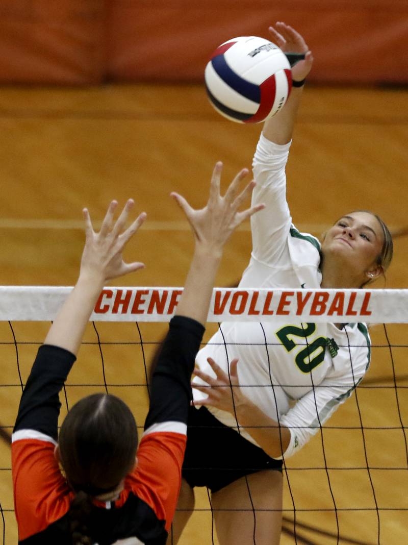 Crystal Lake South's Bobbi Wire hits the ball over the block of McHenry's Teage Wings during a Fox Valley Conference volleyball match on Thursday, Aug. 28, 2025, at the Freshman Campus of McHenry High School in McHenry.