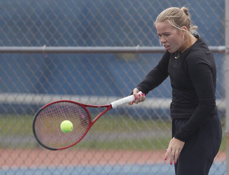 Ottawa’s Emma Cushing returns the ball Thursday, Oct. 19, 2023, during doubles match on the first day of the IHSA State Girls Tennis Tournament at Hoffman Estates High School in Hoffman Estates.
