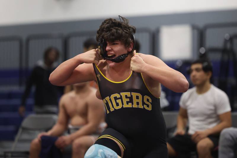 Joliet West’s Andre DeLeon celebrates after clinching a win in the final seconds against Romeoville’s Manny Palomar in a dual meet on Thursday, Dec.14th, 2023 in Romeoville.